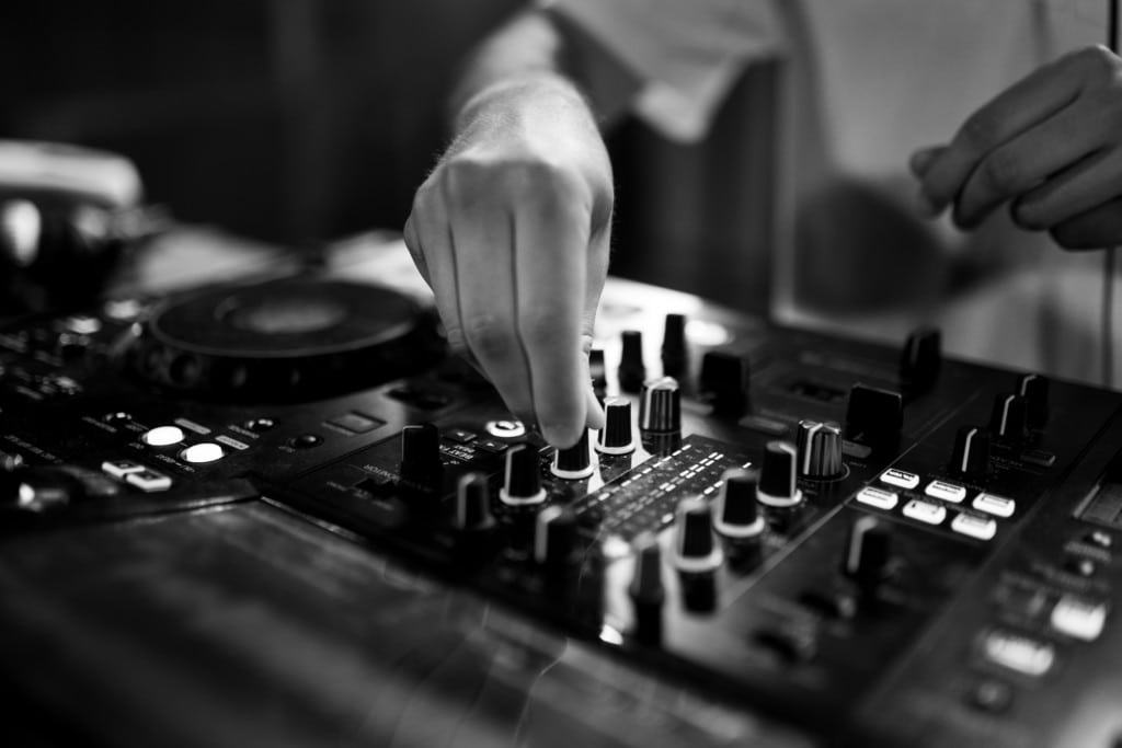 Launch Party Top 10 2 close up of hand adjusting audio mixing board 2026 09 23 04 40 56 utc